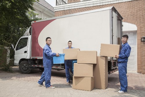 Man with a van loading furniture for a local move in Notting Hill