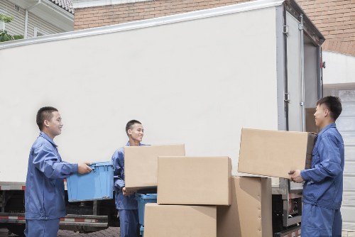 Man and van team safely loading furniture in Notting Hill