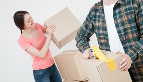 Packed boxes and furniture being loaded for a West London flat removal