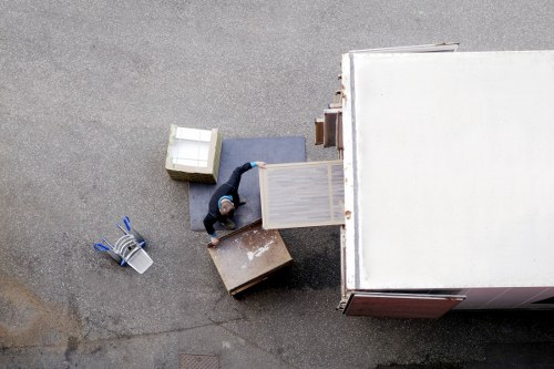 Furniture being moved through a narrow stairwell in a period property