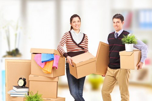 Furniture, boxes, and household items being prepared for a Notting Hill home move