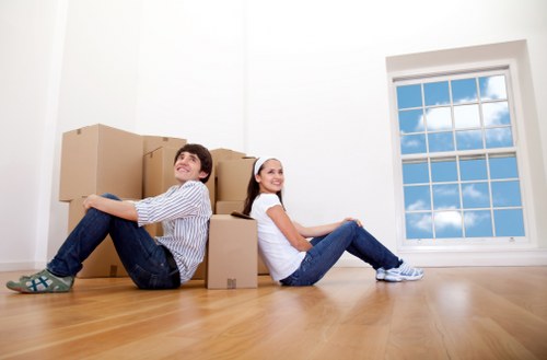 Professional movers handling furniture for a local Notting Hill property