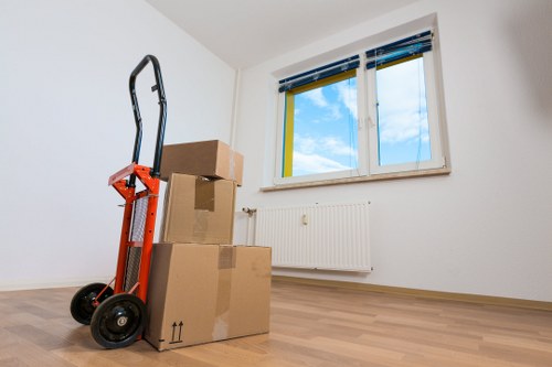 Careful handling of a piano through narrow stairs in a Notting Hill property