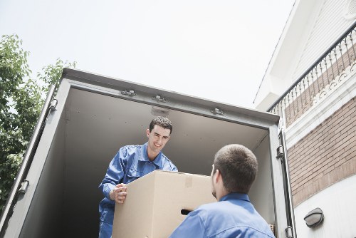 Packed office boxes and electronics prepared for a commercial move in West London