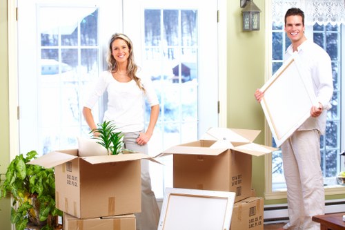 Professional removals team assisting with packing and loading in a Notting Hill flat